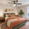 Stylish staged bedroom with fiddle leaf fig tree and art