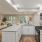Staged kitchen with view of living room