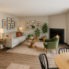 Staged living room, dining area, and kitchen with bar stools