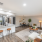Staged apartment living and dining areas with view of kitchen