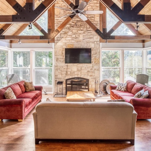 Your new favorite social area a living room with a fireplace